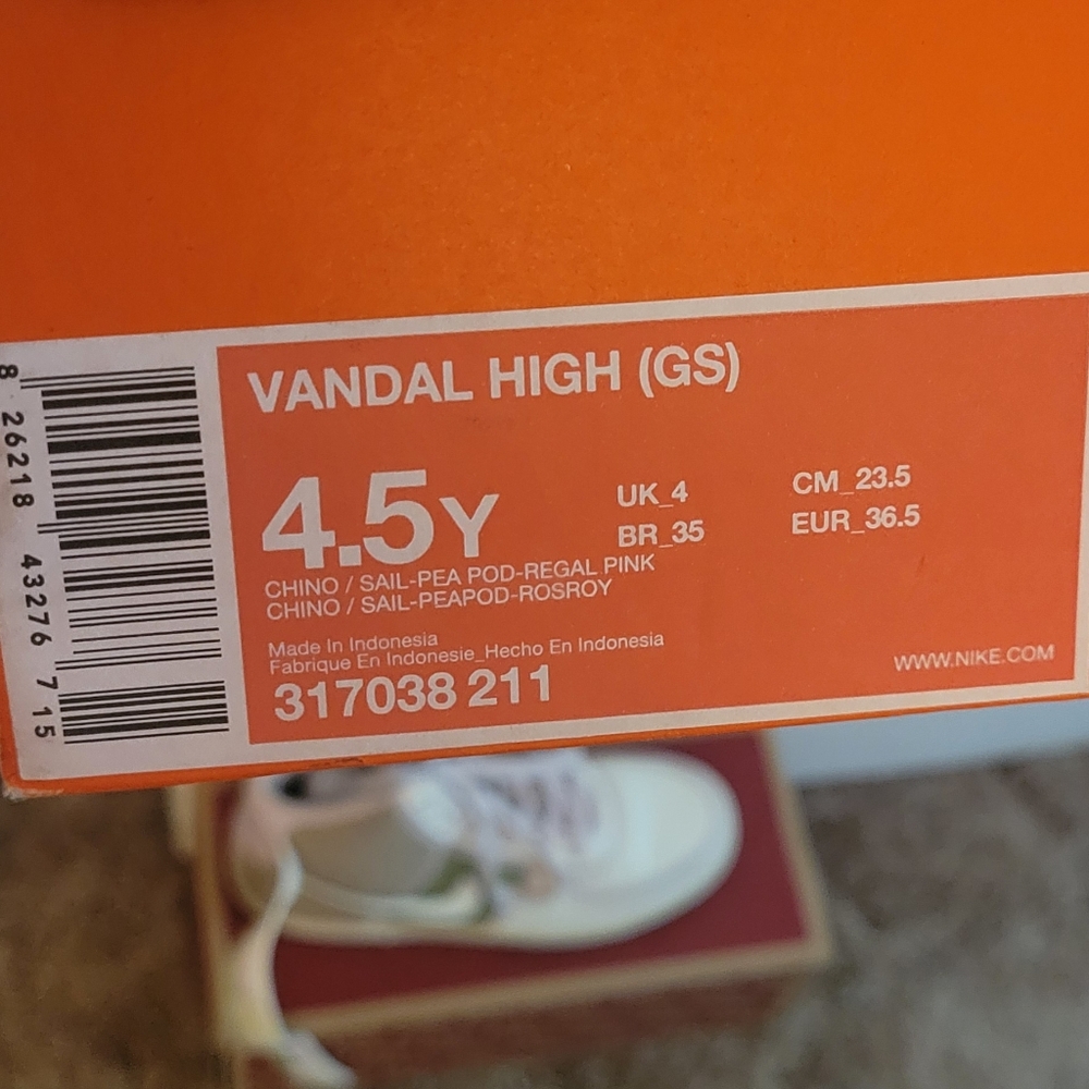 White Nike mid-top sneakers